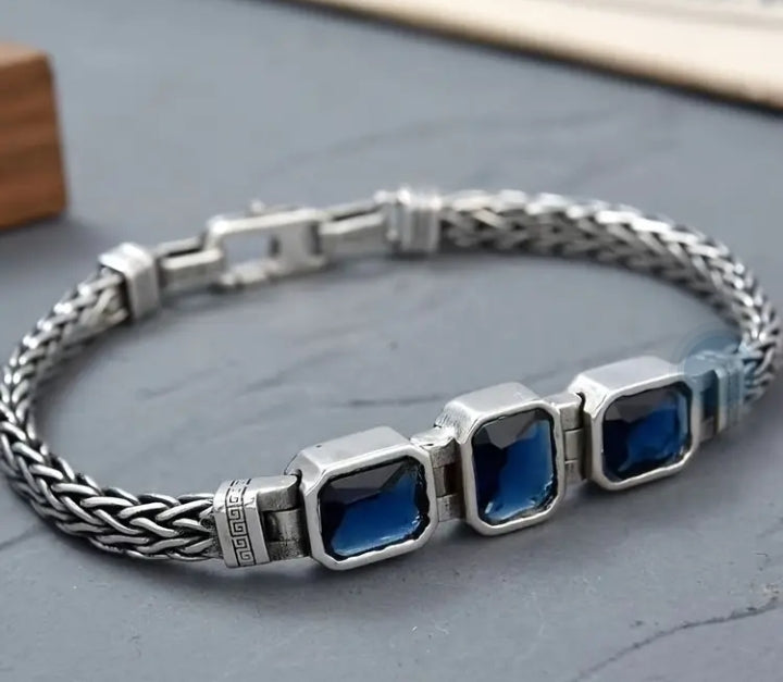 Handwoven braided male bracelet with sapphire blue gemstone